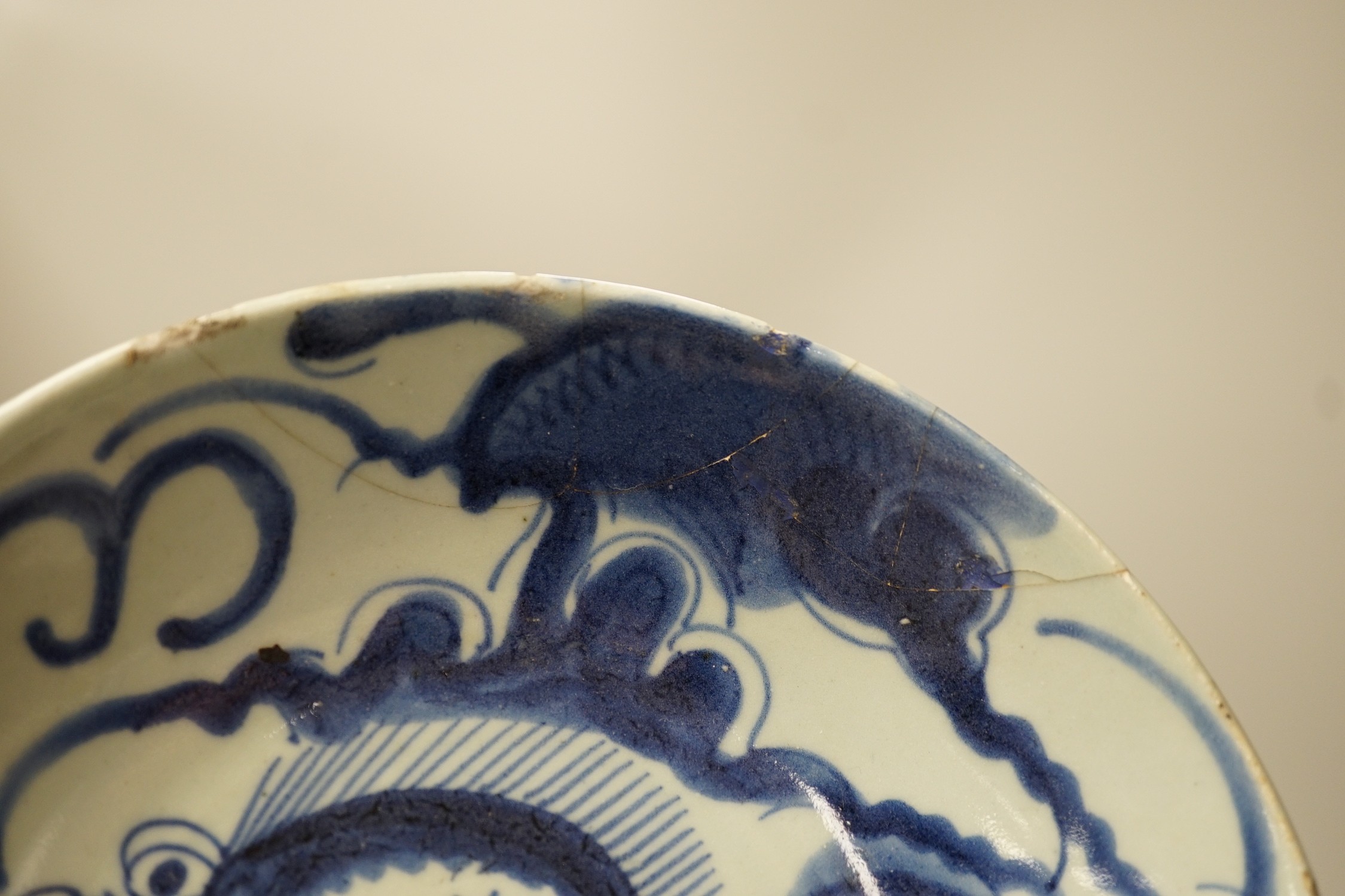 Two 19th century Chinese blue and white dishes and two 18th century tea bowls, largest 23cm diameter